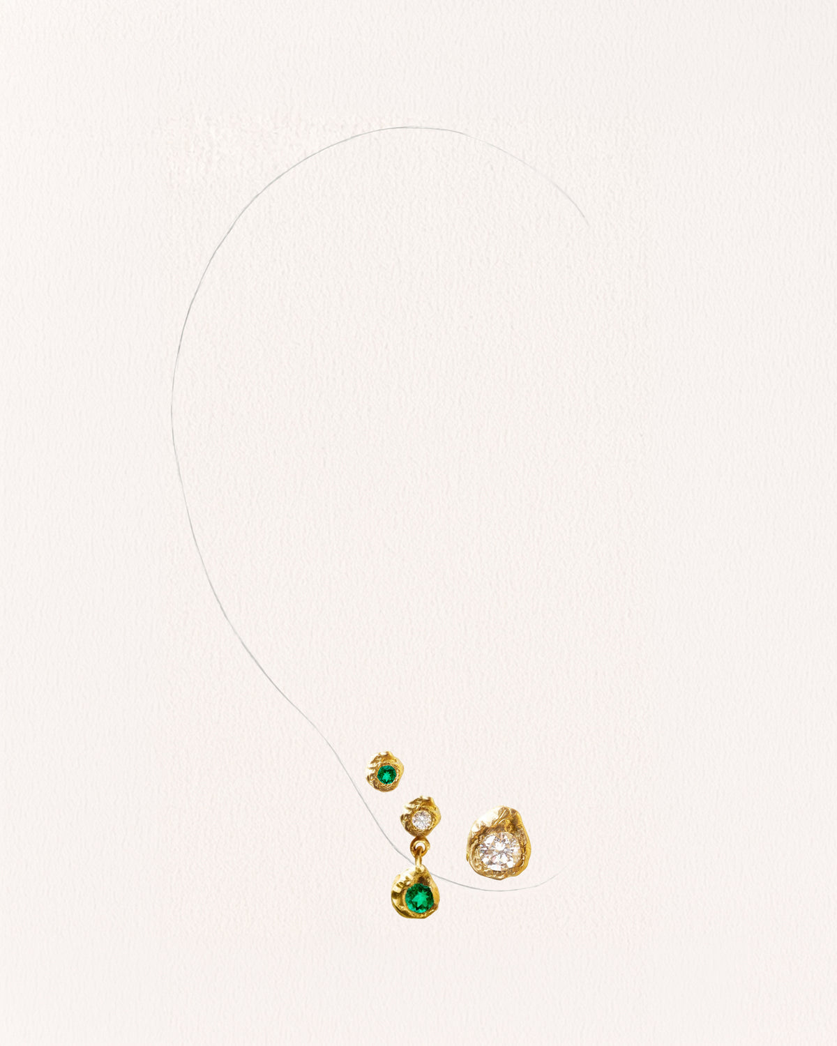Solitaire Iman 0.20 ct Diamond Gold Earring [Single] & Evie 0.05 ct Emerald Gold Earring & Solitaire Esmeralda 0.15 Emerald and Diamond Gold Earring [Single]- On Ear | Elhanati